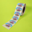 Roll of Happy Hippos Magic Fruit Gummies stickers on a green background