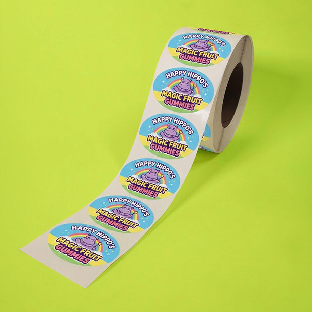 Roll of Happy Hippos Magic Fruit Gummies stickers on a green background