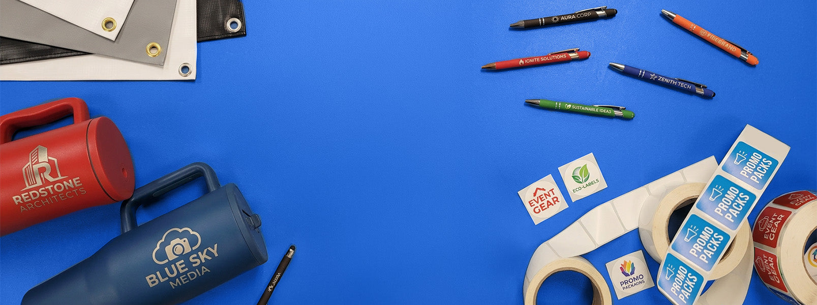 Assorted office supplies including markers, scissors, and tape on a blue background