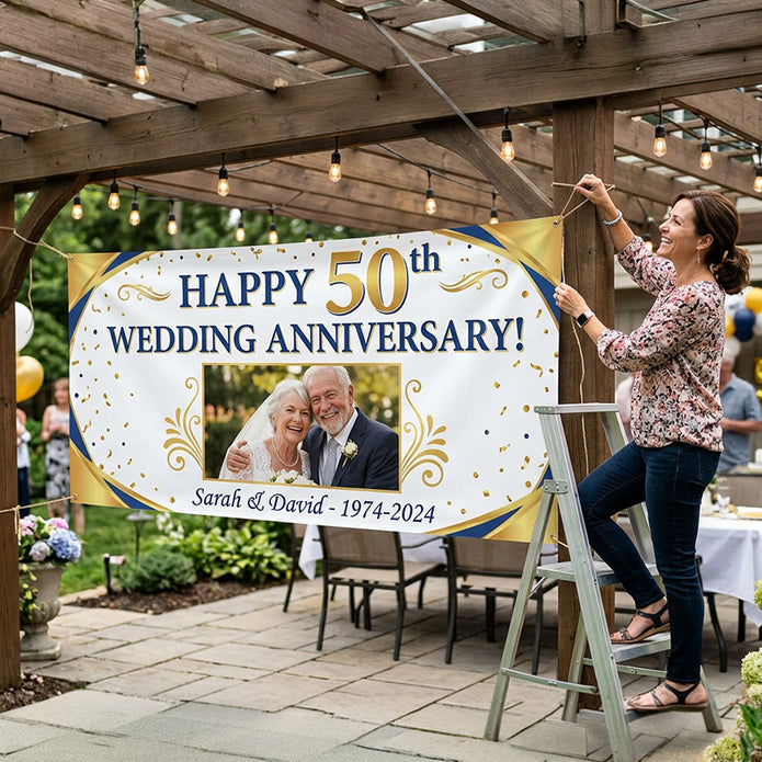 Woman hanging a 'Happy 50th Wedding Anniversary!' banner with a photo of an elderly couple outdoors.