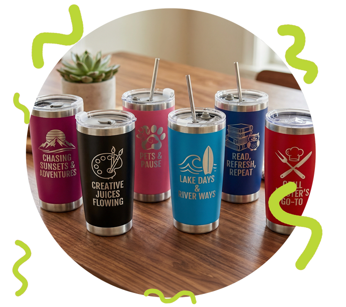 Set of colorful tumblers with designs and text on a wooden surface