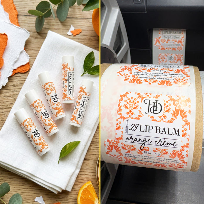 Lip balm with decorative labels on a wooden surface and on a roll of labels off of a printing machine.