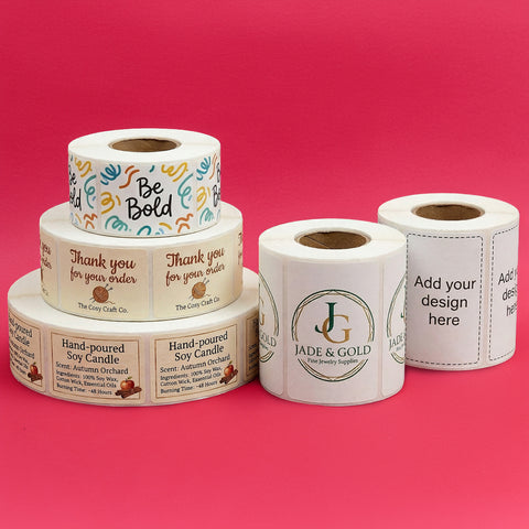 Rolls of customizable labels on a pink background