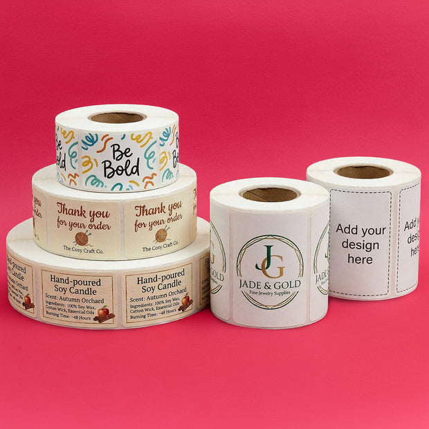 Rolls of customizable labels on a pink background