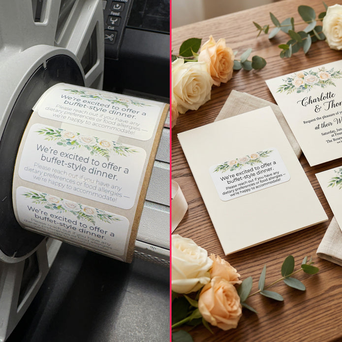 Roll of printed buffet-style dinner invitations with a printer and flowers on a wooden surface.