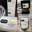 SD Craft Jerky packaging with 'Sweet Heat' and 'Lemon Grass Curry' labels on a wooden surface.