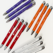 Set of pens in red, white, and orange with 'Class of 2016' and '2024 Academic Conference' text on a white background.