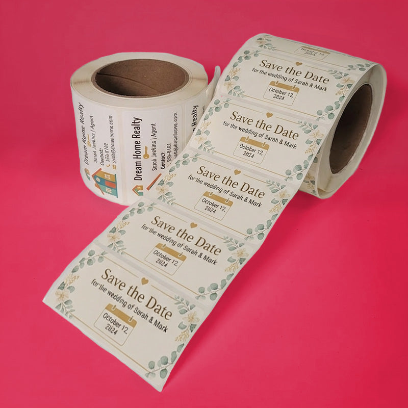 Roll of 'Save the Date' wedding invitations on a pink background