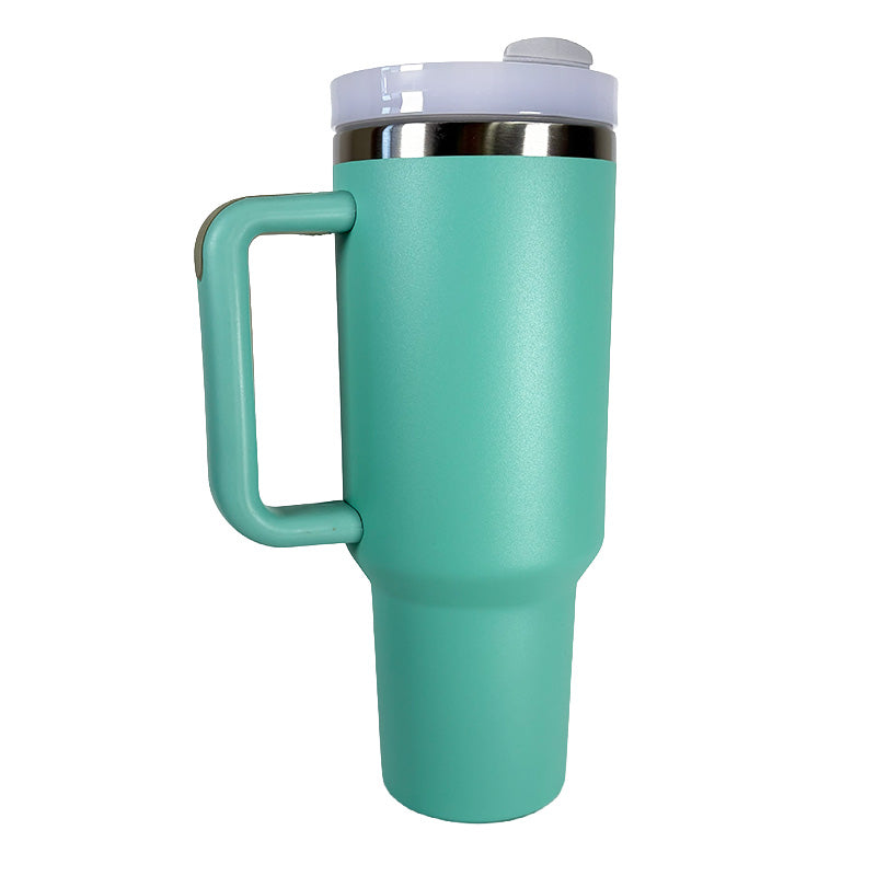 Turquoise travel mug with a handle on a white background