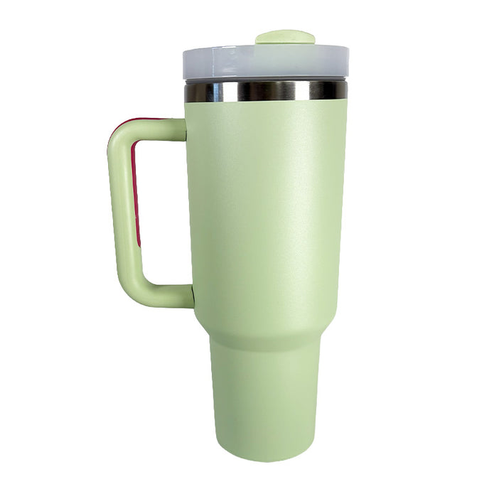 Light green travel mug with a handle on a white background