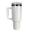 White travel mug with a silver lid on a white background