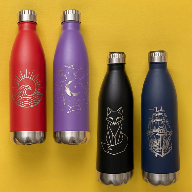 Four insulated bottles with engraved designs on a yellow background