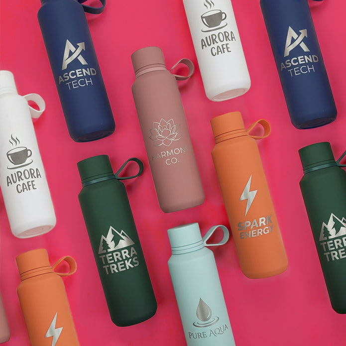 Collection of branded water bottles on a pink background